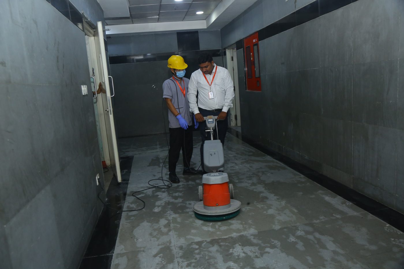 UFMS floor polishing team at work